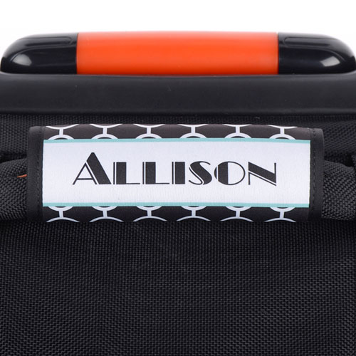 Envoltura de manija de equipaje personalizada con círculos negros y marco de color aqua 