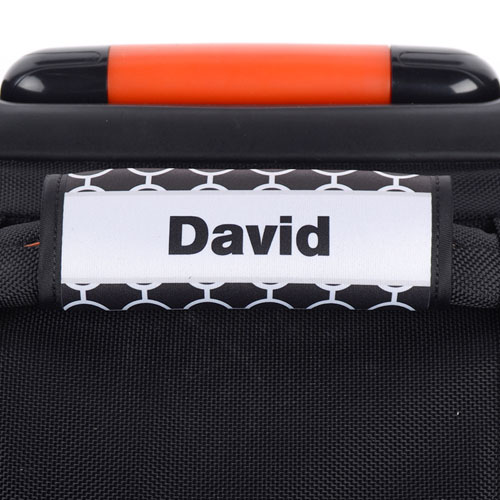 Envoltura de asas del equipaje personalizada con marco gris y círculo negro.